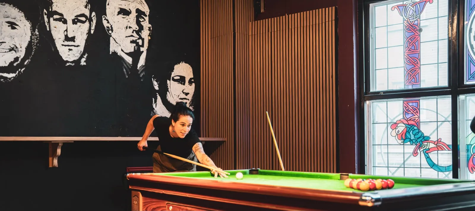 Pool match night beside the mural at Plunkets Dublin city centre pub