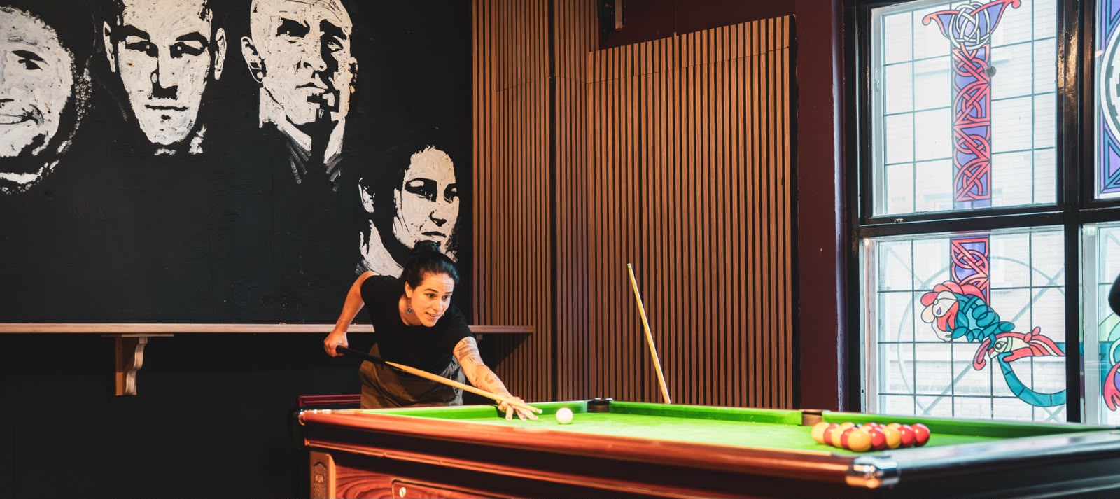 Pool match night beside the mural at Plunkets Dublin city centre pub