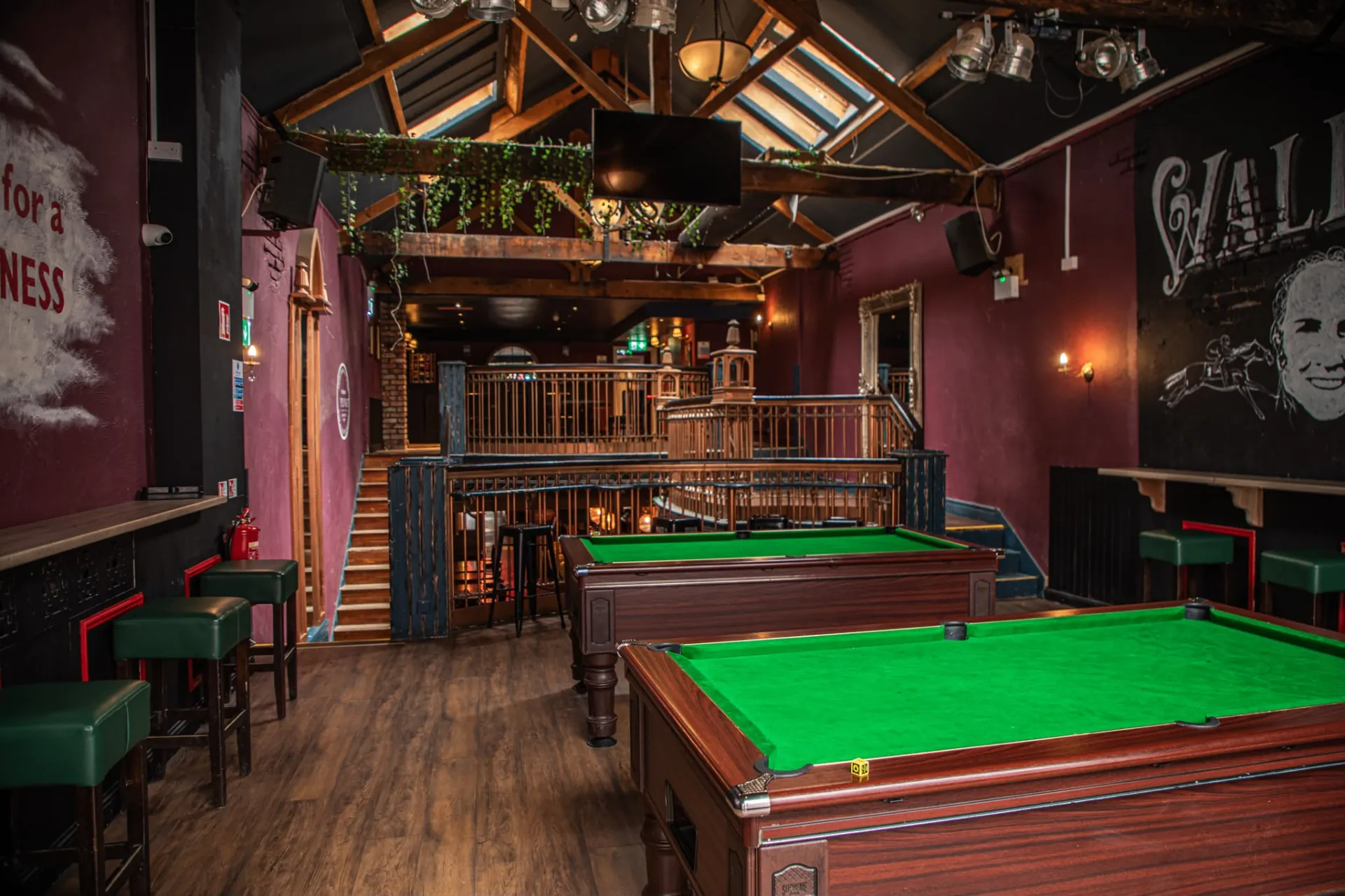 Wall of Games pool and darts room with timber rafters at Plunkets Dublin pub